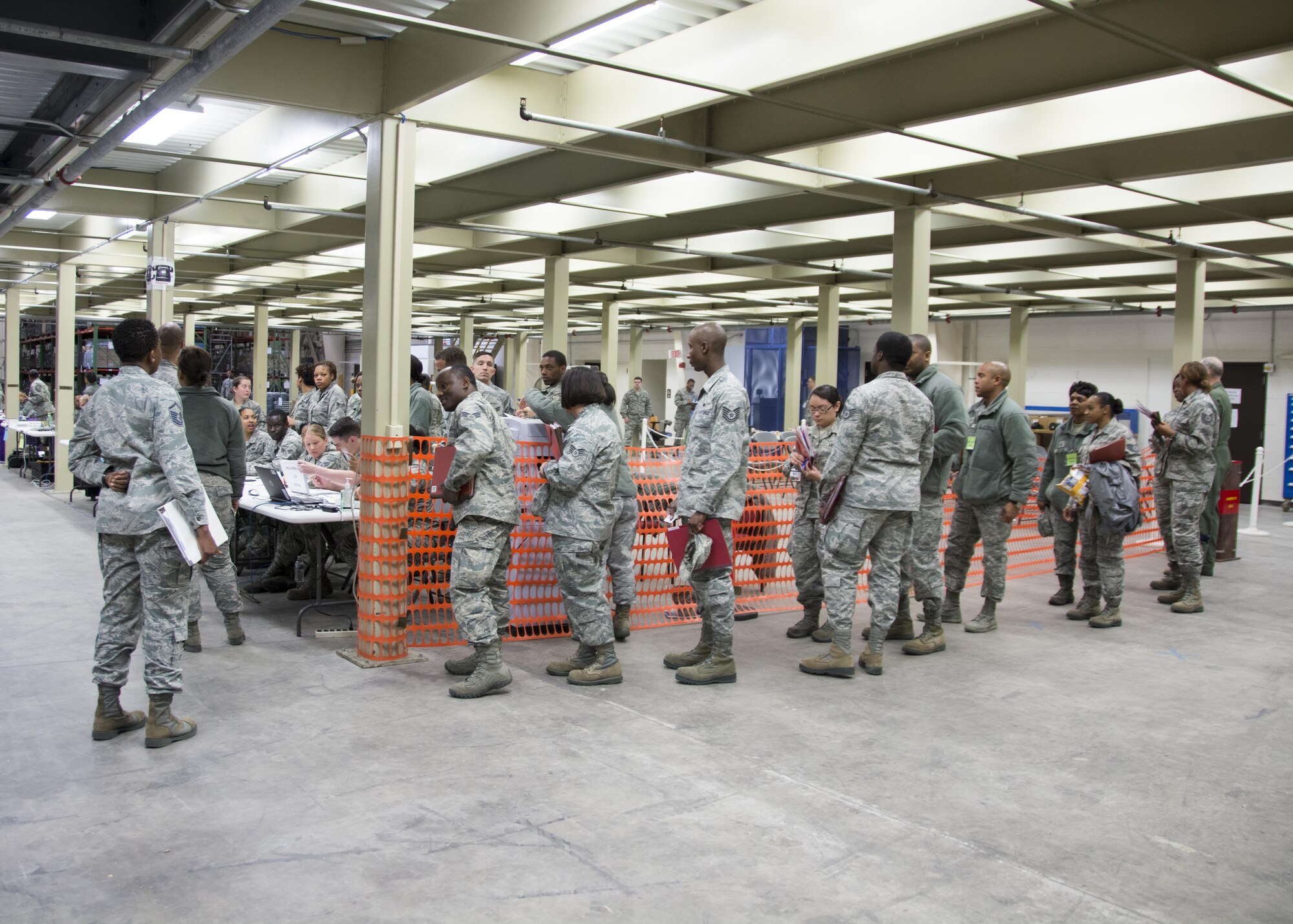 Air Force reservists with the 512th Airlift Wing process through a pre-deployment function line, Dover Air Force Base, Del. Apr. 2, 2017. The deployment exercise provided an effective training opportunity for the 512th Force Support Squadron to practice their functions and for wing members to familiarize themselves with the process. (U.S. Air Force Photo/Senior Airman Damien Taylor)