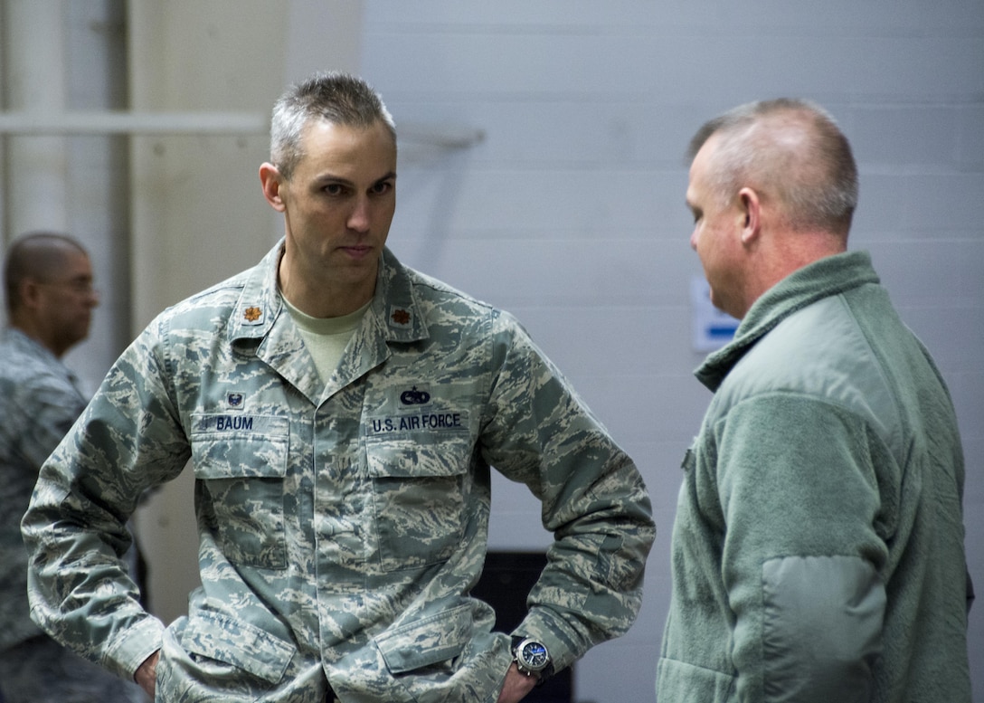Maj. Jon Baum, 512th Logistics Readiness Squadron commander, speaks with Col. D. Scott Durham, 512th Airlift Wing commander, about the progress of the pre-deployment function line exercise at Dover Air Force Base, Apr. 2, 2017. The wing conducted the exercise to display capabilities and test deployment readiness.  (U.S Air Force Photo/Senior Airman Damien Taylor)