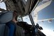 Capt. Kyle Wagner, right, 167th Airlift Wing pilot, mans the controls of a C-17 Globemaster III aircraft as the boom of a KC-135 Stratotanker from the 128th Air Refueling Wing, Wisconsin Air National Guard, is manuevered toward the C-17 during aerial refueling training, April 4. (U.S. Air National Guard photo by Senior Master Sgt. Emily Beightol-Deyerle)