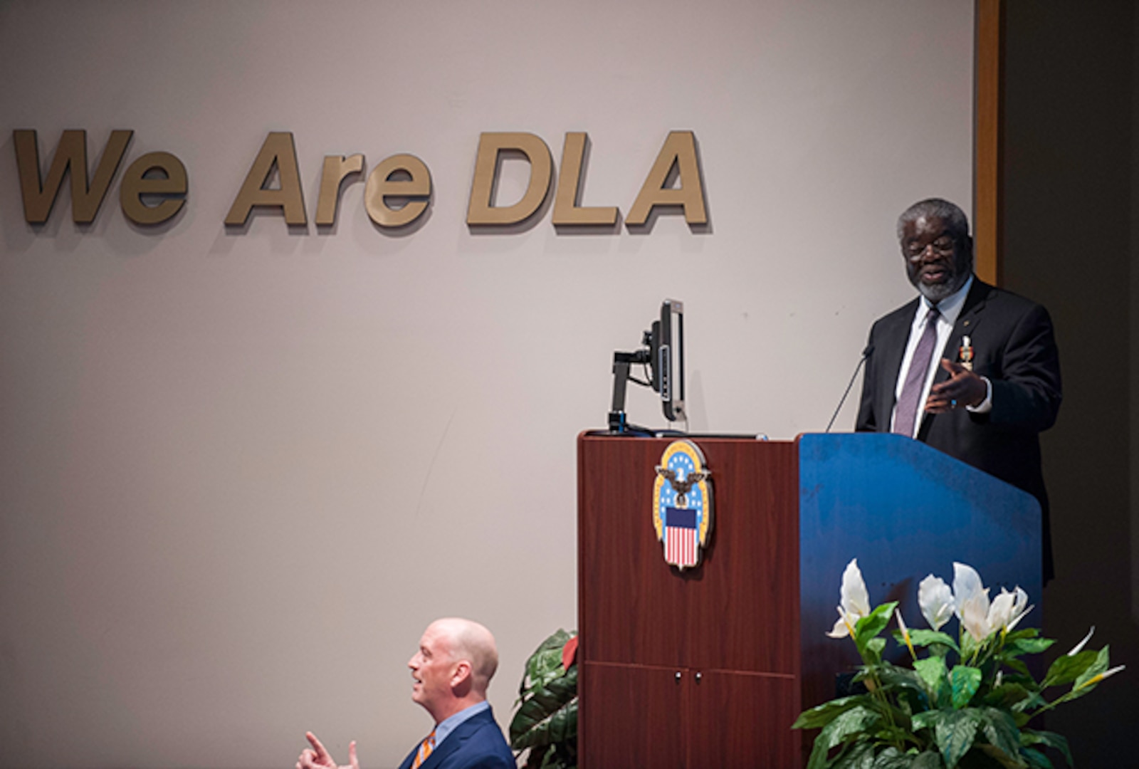 Milton Lewis, Acquisition Executive at DLA Land and Maritime, reminisced about assignments and experiences during his career during a March 31 retirement ceremony.