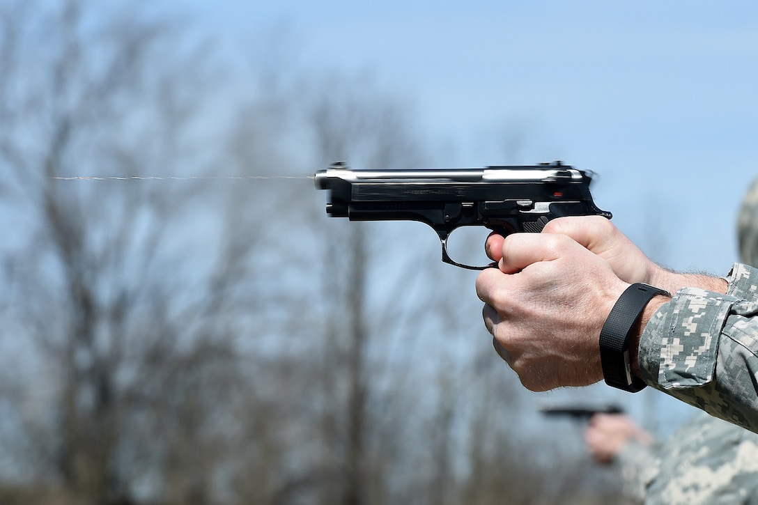 An Army Reserve Soldier fires a round from an M9 pistol during the 85th Support Command’s individual weapons qualification at the Joliet Training Area, Apr. 1, 2017. The headquarters staff  spent one battle assembly day at the qualification range achieving a 100 percent qualification rate on the M-16 rifle and an 88 percent qualification rate on the M9 pistol. 
(U.S. Army Reserve photo by Sgt. Aaron Berogan)