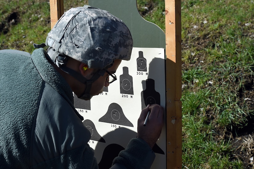 Army Reserve Spc. Matthew Kelly, Human Resources Specialist, 85th Support Command, reviews his qualification performance during the 85th Support Command’s headquarters individual weapons qualification at Joliet Training Area, April 1, 2017. The headquarters staff spent one battle assembly day at the qualification range achieving a 100 percent qualification rate on the M-16 rifle and an 88 percent qualification rate on the M9 pistol. Kelly qualified with 34 out of 40 targets hit.
(U.S. Army Reserve photo by Sgt. Aaron Berogan)
