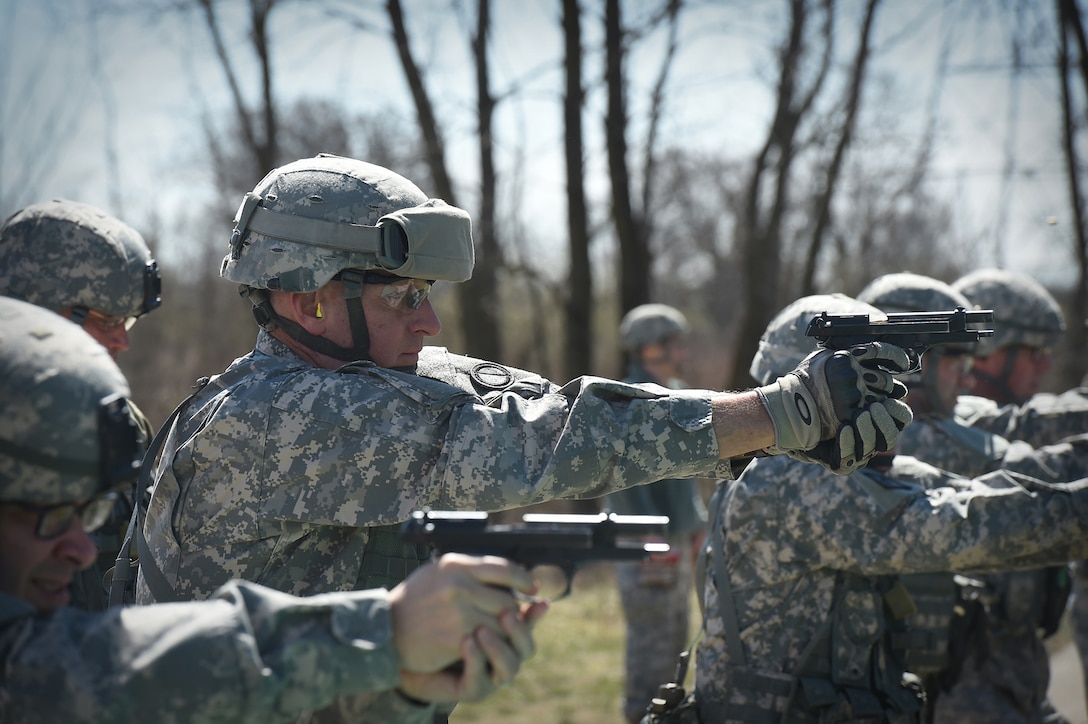 Col. Robert Cooley, Deputy Commander, 85th Support Command, engages his targets on the M9 qualification range during the headquarters individual weapons qualification at Joliet Training Area, Apr. 1, 2017. The headquarters staff spent one battle assembly day at the range to qualify on the M16 rifle and M9 pistol achieving a 100 percent qualification rate on the M-16 and an 88 percent qualification rate on the M9.
(U.S. Army Reserve photo by Sgt. Aaron Berogan)