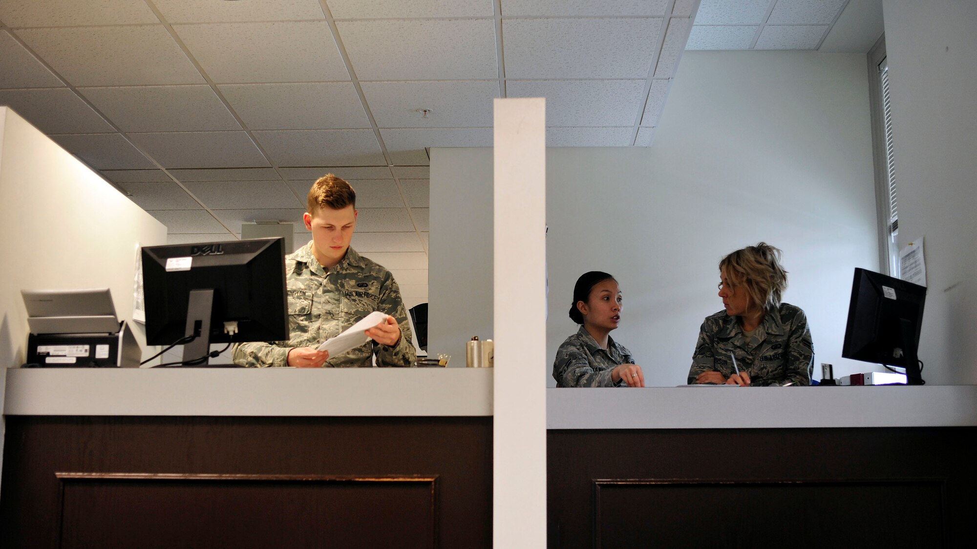 Airman 1st Class James Lenington (left), 62nd Comptroller Squadron financial services technician, Airman 1st Class Joyce Stewart (center), 62nd CPTS financial services technician, and Airman 1st Class Kelly McPherson (right), 62nd CPTS financial services technician, perform training and administrative tasks while waiting for customers to arrive at the finance office, April 4, 2017 at McChord Field, Wash. Financial technicians are available to help with military pay, travel pay to include permanent change of station and temporary duty, LeaveWeb, and civilian pay and disbursing. (U.S. Air Force photo/Staff Sgt. Whitney Amstutz)