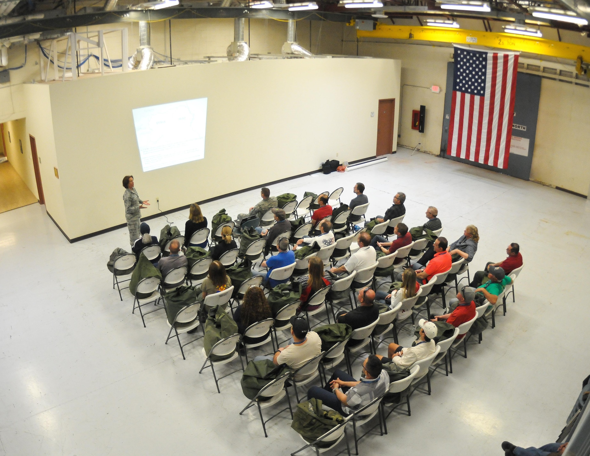 Lt. Col. Shawn Ortiz, 944th Operations Group intelligence officer, gives a simulated intelligence brief to civilian employers Apr.1 during Bosses Day 2017 at Luke Air Force Base, Ariz. (U.S. Air Force photo by Tech. Sgt. Nestor Cruz)