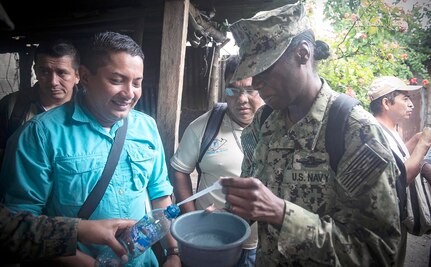 Lt. Cmdr. Jinaki Gourdine (right), assigned to Navy Environmental and Preventive Medicine Unit, or NEPMU, 2, from Norfolk, Va., takes a sample of mosquito-larva contaminated rainwater in the Barrios El Rastro neighborhood of Puerto Barrios, Guatemala, during Continuing Promise 2017, or CP-17, Feb. 10. CP-17 is a U.S. Southern Command-sponsored and U.S. Naval Forces Southern Command/U.S. 4th Fleet-conducted deployment to conduct civil-military operations including humanitarian assistance, training engagements, medical, dental, and veterinary support in an effort to show U.S. support and commitment to Central and South America. 