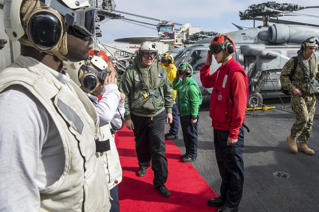 Deputy Defense Secretary Bob Work arrives on board the aircraft carrier USS Nimitz to meet with officers and crew off the coast of San Diego, April 4, 2017. DoD photo by Air Force Staff Sgt. Jette Carr