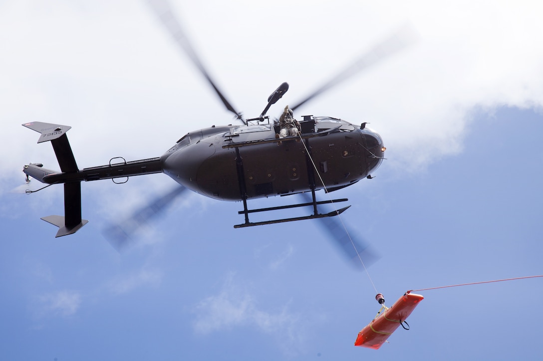 An Army UH-72 Lakota helicopter extracts a mock casualty during operation Vigilant Guard, Tifton, Ga., March 28, 2017. The helicopter crew is assigned to the Georgia Army National Guard’s 78th Aviation Troop Command, Detachment 1, Company C, Security and Support Battalion. Army photo by Spc. Jesse Coggins 