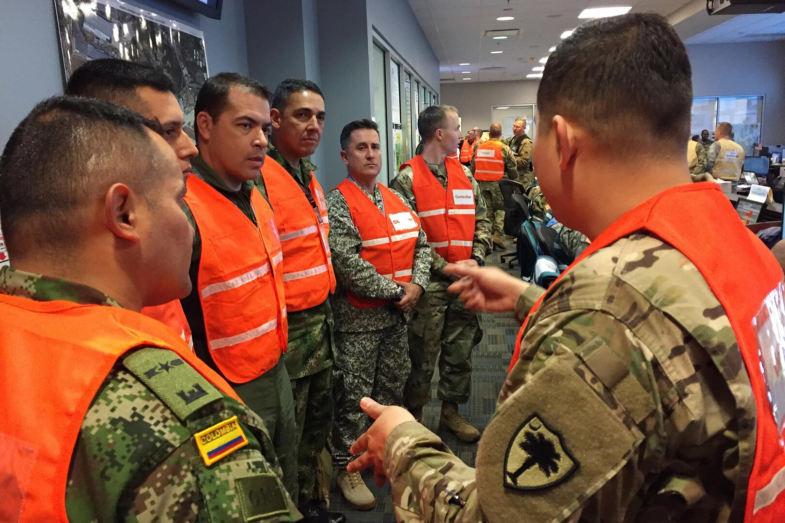 U.S. Army Sgt. Alex Chavez, right, a Soldier with the South Carolina Army National Guard, answers questions and translates into Spanish during a tour of the Georgia National Guard’s Joint Operations Center at the Clay National Guard Center in Marietta, Ga., March 30, 2017. Five officers from the Colombian military toured multiple sites in Georgia during the National Guard’s Defense Support to Civilian Agencies exercise called Vigilant Guard. The South Carolina National Guard is partnered with Colombia through the State Partnership Program and hosted the Colombian officers.