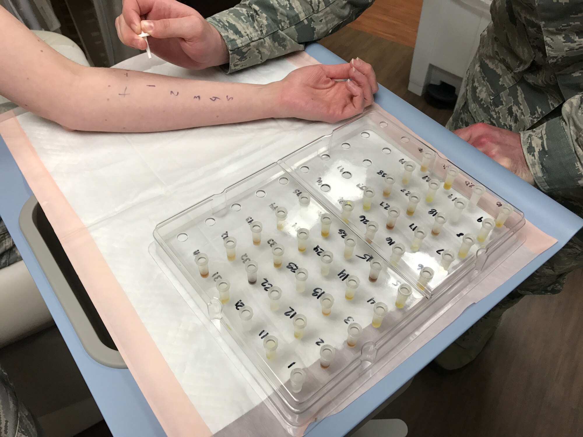 SrA Matthew Howard-Dahrling, 779th Medical Group medical technician conducts allergy testing on a patient to identify environmental allergens. (photo by Ms. Monica Soper)