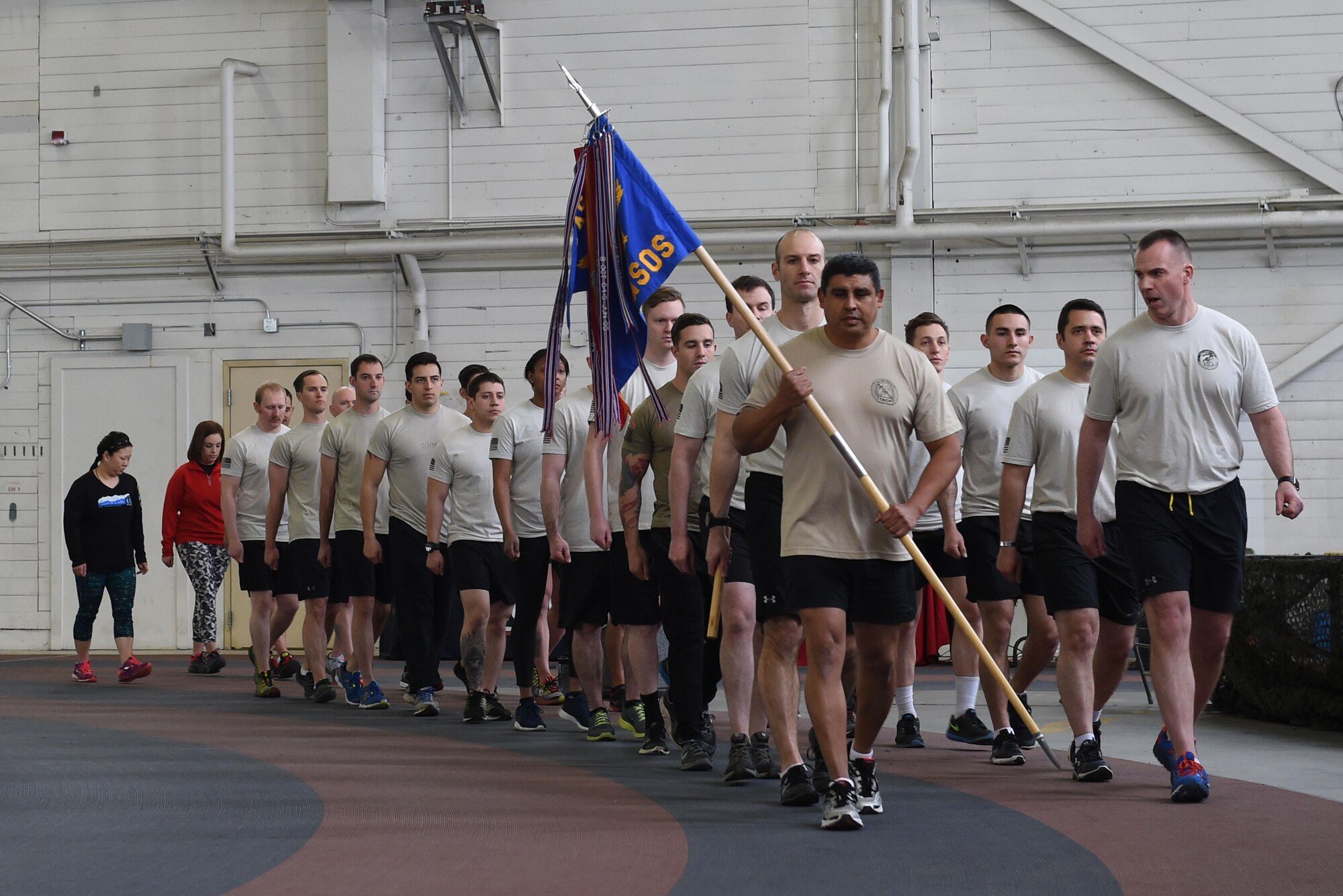 Members of the 3rd Air Support Operations Squadron complete a lap as a team in Hangar 5 at Joint Base Elmendorf-Richardson, Alaska, March 30, 2017, during the annual 24-hour run challenge. During the challenge, at least one tactical air control party member ran at any point during the 24 hours. The TACP Airmen also passed a baton listing the names of fallen TACP Airmen to ensure those who made the ultimate sacrifice are never forgotten. 