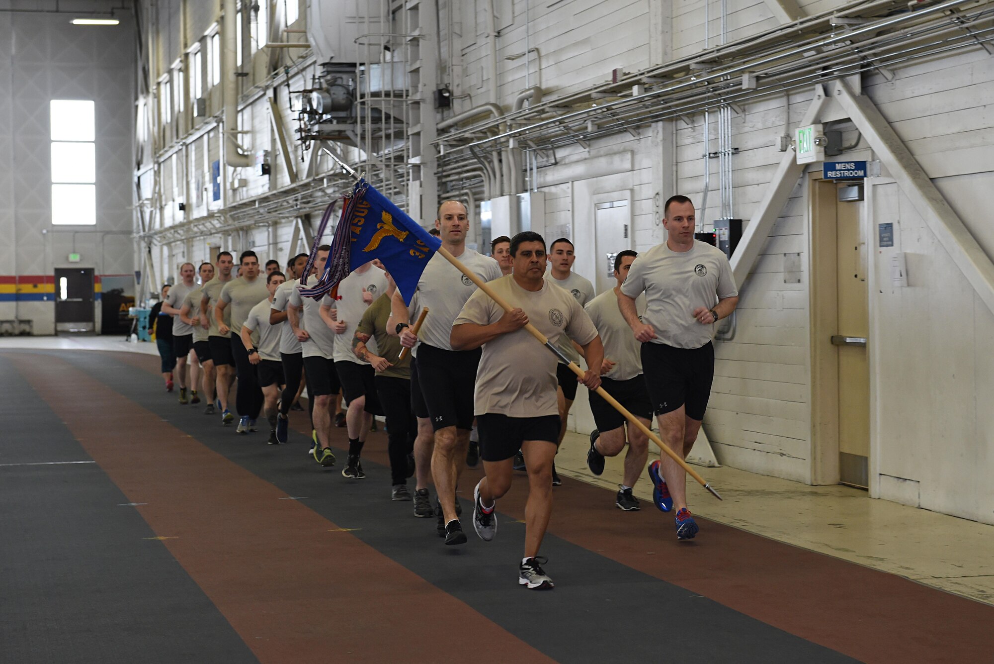 Members of the 3rd Air Support Operations Squadron complete a lap as a team in Hangar 5 at Joint Base Elmendorf-Richardson, Alaska, March 30, 2017, during the annual 24-hour run challenge. During the challenge, at least one tactical air control party member ran at any point during the 24 hours. The TACP Airmen also passed a baton listing the names of fallen TACP Airmen to ensure those who made the ultimate sacrifice are never forgotten. 
