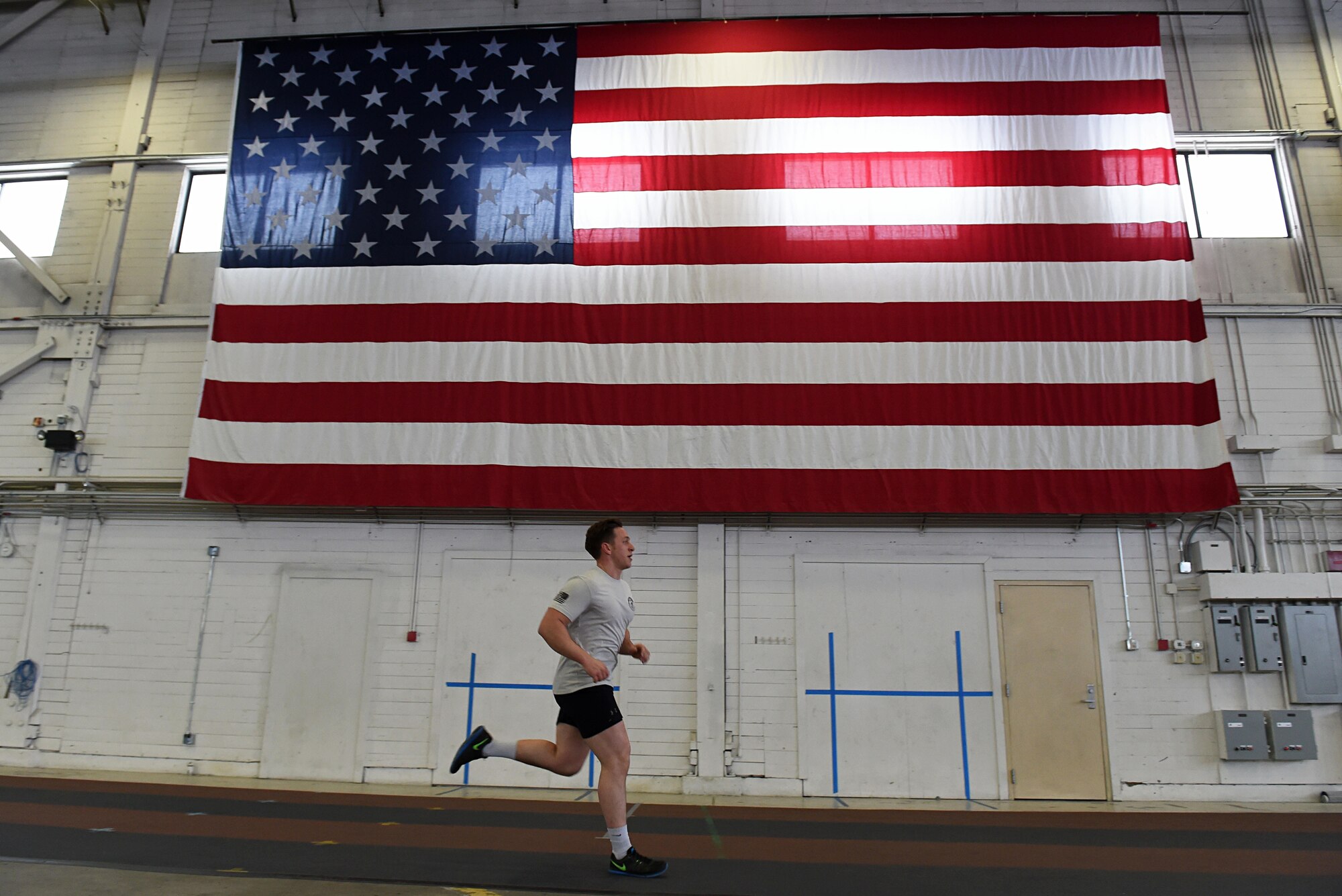Members of the 3rd Air Support Operations Squadron participate in the annual 24-hour run challenge in Hangar 5 at Joint Base Elmendorf-Richardson, Alaska, March 30, 2017. During the challenge, at least one tactical air control party member ran at any point during the 24 hours. The TACP Airmen also passed a baton listing the names of fallen TACP Airmen to ensure those who made the ultimate sacrifice are never forgotten. 