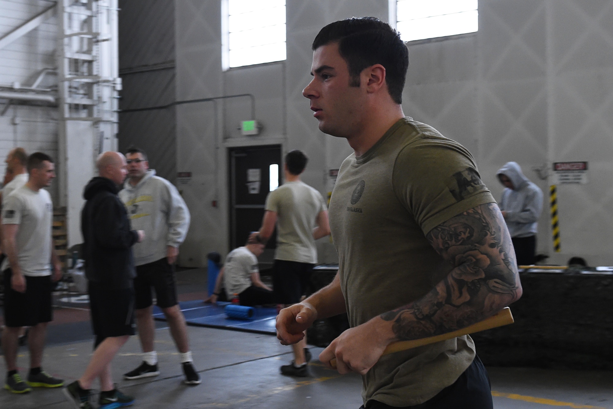 Members of the 3rd Air Support Operations Squadron participate in the annual 24-hour run challenge in Hangar 5 at Joint Base Elmendorf-Richardson, Alaska, March 31, 2017. During the challenge, at least one tactical air control party member ran at any point during the 24 hours. The TACP Airmen also passed a baton listing the names of fallen TACP Airmen to ensure those who made the ultimate sacrifice are never forgotten. (U.S. Air Force photo by Airman 1st Class Valerie Monroy)