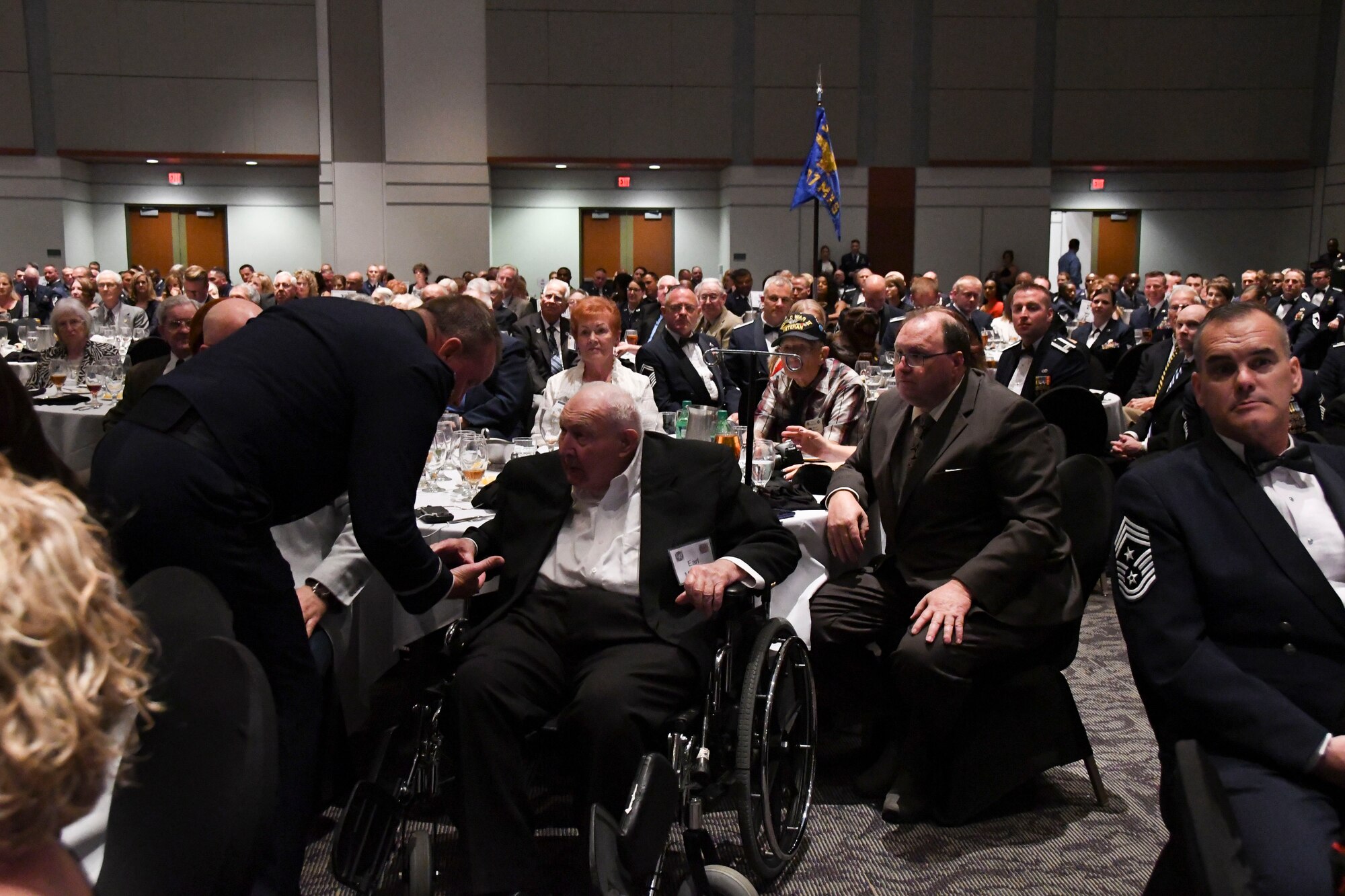 Col. Bruce R. Cox, 307th Bomb Wing commander, presents Earl McGuier, World War II 307th Bombardment Group veteran, with a Commander’s Coin during the 307th Bomb Wing’s 75th Anniversary and Awards Gala at the Shreveport Convention Center April 1, 2017. In 1942, 27 B-24 Liberators from the 307th Bombardment Group took part in one of the longest mass-raids of that era which earned them the name “The Long Rangers.” The now, 307th Bomb Wing celebrated their 75th Anniversary with alumni from wars such as World War II, Korean War, Vietnam and Operation Inherent Resolve. (U.S. Air Force photo by Staff Sgt. Callie Ware/Released)