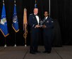 Col. Bruce R. Cox, 307th Bomb Wing commander, presents Senior Airman Timothy Rice, 707th Maintenance Squadron, the 307th Bomb Wing’s Airman of the Year award for 2016. The award was presented during the 307th Bomb Wing’s 75th Anniversary and Awards Gala at the Shreveport Convention Center April 1, 2017. (U.S. Air Force photo by Staff Sgt. Callie Ware/Released)