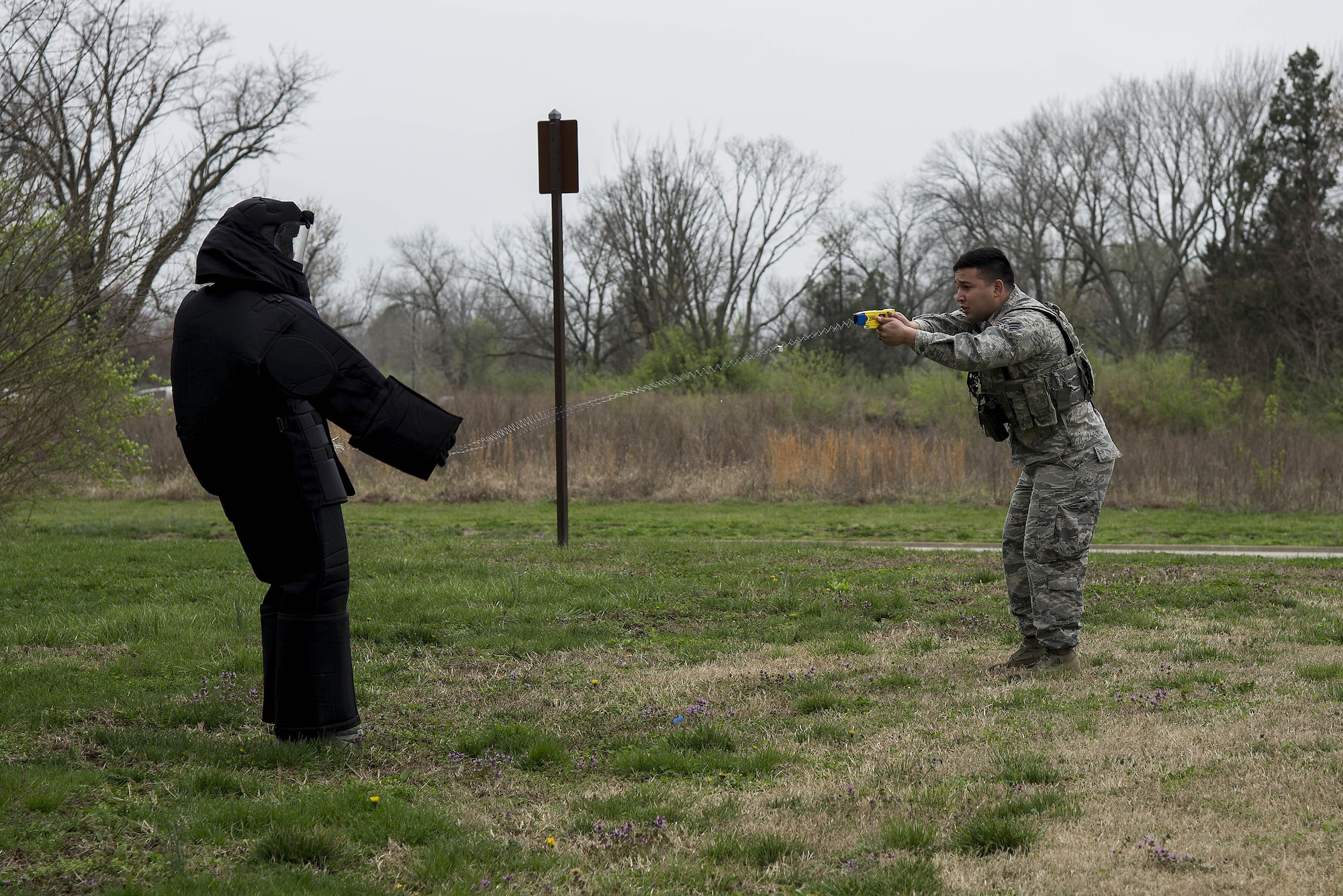 Senior Airman Leonardo Reyes Jr. (right), 375th Security Forces Squadron, fires a taser at Airman 1st Class Glenn Hodges, also 375th SFS, at Scott Air Force Base, Illinois, March 28, 2017. This was part of a demonstration held for Junior Reserve Officer Training Corps members and was designed to show them how SF members use tasers to subdue suspects. (U.S. Air Force photo by Tech. Sgt. Jonathan Fowler)