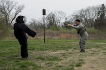 Senior Airman Leonardo Reyes Jr. (right), 375th Security Forces Squadron, fires a taser at Airman 1st Class Glenn Hodges, also 375th SFS, at Scott Air Force Base, Illinois, March 28, 2017. This was part of a demonstration held for Junior Reserve Officer Training Corps members and was designed to show them how SF members use tasers to subdue suspects. (U.S. Air Force photo by Tech. Sgt. Jonathan Fowler)