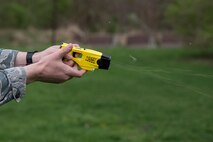 Staff Sgt. Corey Ormsby, 375th Security Forces Squadron, fires a taser at Scott Air Force Base, Illinois, March 28, 2017. Ormsby was demonstrating proper firing and use procedures for Junior Reserve Officer Training Corps members which also included a military working dog demonstration and showcasing ‘drunk goggles,’ which simulate the effect of alcohol impairment. (U.S. Air Force photo by Tech. Sgt. Jonathan Fowler)