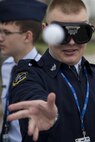 A Junior Reserve Officer Training Corps member attempts to accurately throw a ping pong ball while wearing ‘drunk goggles’ at Scott Air Force Base, Illinois, March 28, 2017. ‘Drunk Goggles’ are used to demonstrate various levels of alcohol impairment and are used by 375th Security Forces Members to showcase how being intoxicated can make simple actions more difficult and to emphasize the risks of driving while under the influence. (U.S. Air Force photo by Tech. Sgt. Jonathan Fowler)