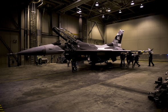 A U.S. Air Force F-16 Fighting Falcon aircraft sits in a hangar April 4, 2017, at Eielson Air Force Base, Alaska. The F-16 recently received a new paint scheme called “Splinter,” which is being adopted as the standard pattern for the 18th Aggressor Squadron’s aircraft. (U.S. Air Force photo by Airman Eric M. Fisher)