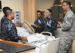 Tech. Sgt. Rey Meza (right) and Chief Petty Officer Jacklyn Place (second from right), instructors at the Medical Education and Training Campus, or METC, teach students during a nursing lab portion of the Basic Medical Technician Corpsman Program, or BMTCP at Joint Base San Antonio-Fort Sam Houston Sept. 20, 2016. The Navy surgeon general announced a revision to the hospital corpsman 'A' School, currently BMTCP, with plans to roll out the changes this July. 