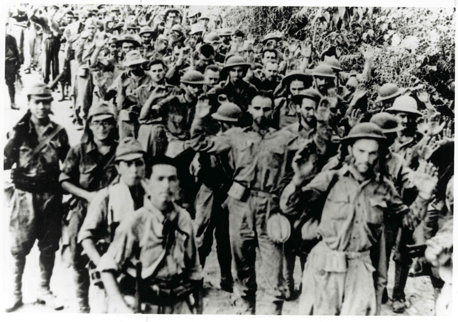 U.S. Army National Guard and Filipino soldiers shown at the outset of the Bataan Death March. Allied forces were forced to surrender to the Japanese on April 9, 1942, the largest surrender in U.S. history. Their defense and sacrifice under dire circumstances allowed the United States badly needed time to mobilize in the Pacific Theater of War, and avoided a greater catastrophe beyond the bombing of Pearl Harbor in December 1941.