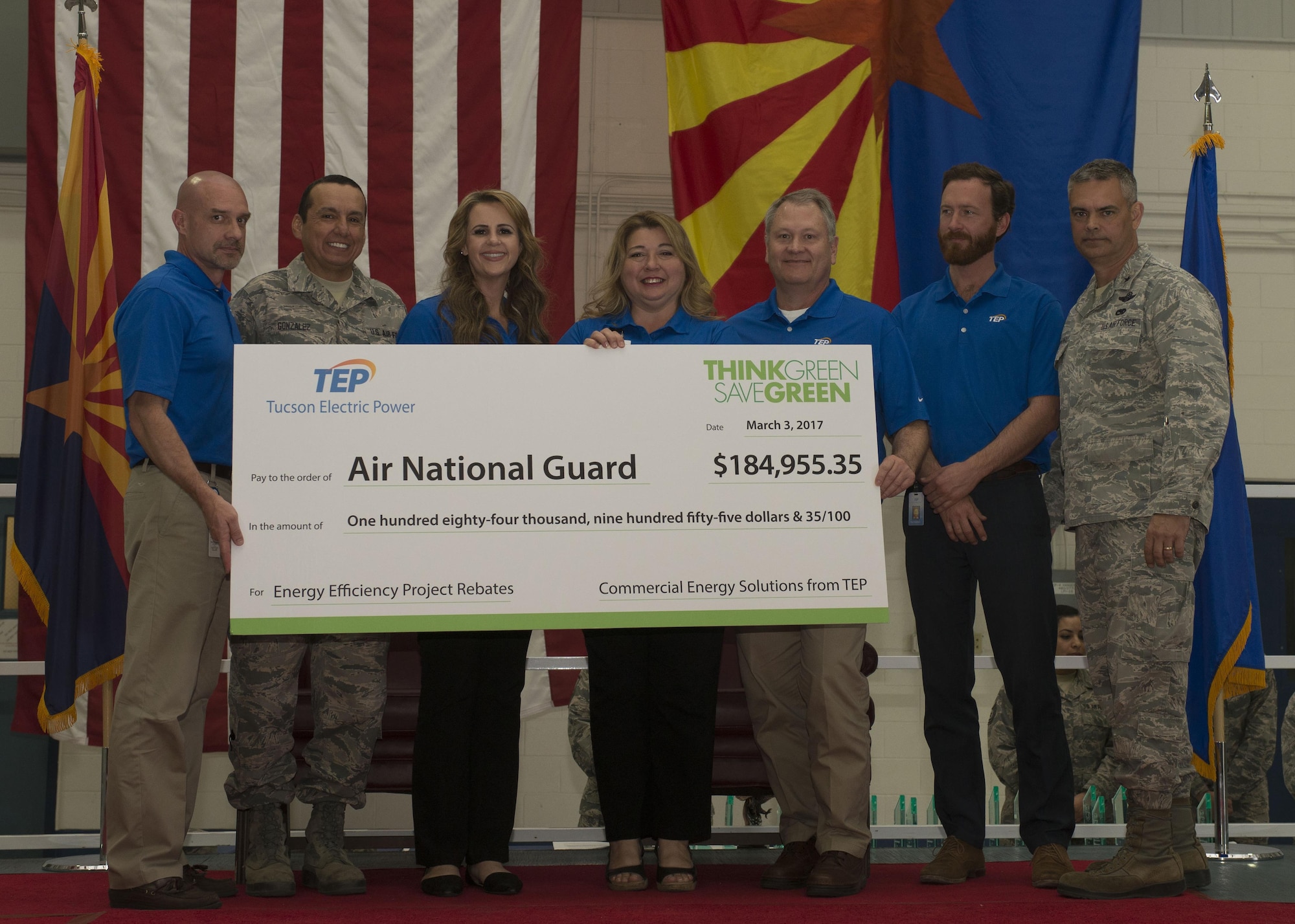 The 162nd Wing of the Arizona Air National Guard recognized its annual award winners from 2016 in a ceremony at the Tucson International Airport April 2. During the ceremony the wing's energy efficiency partners from Tucson Electric Power presented Brig. Gen. Andrew MacDonald with a check in recognition of two cost saving energy projects completed during 2016. (U.S.Air National Guard photo by Staff Sgt. Gregory Ferreira)
