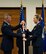 (Right) Maj. Jennifer Cornell, 926th Force Support Squadron Commander, receives the guidon from Col. Paul Fast, 926th Wing Vice Commander, during her change of command ceremony March 31 at the Nellis Air Force Base Club. (U.S. Air Force photo/Senior Airman Alexandria Slade)