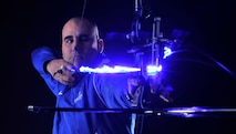 Tech. Sgt. Michael Christiansen, a 100th Security Forces Squadron assistant flight chief, draws back a bow and arrow March 28, 2017, at RAF Mildenhall, England. Christiansen was selected to represent U.S. Air Forces in Europe at the 2017 Department of Defense Warrior Games in Chicago where he will compete in the rifle, pistol, recurve archery and sitting volleyball events. (U.S. Air Force photo/Staff Sgt. Micaiah Anthony)