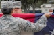 Senior Airman Jamela Shannon, 96th Medical Group, holds up the American flag during the flag-folding portion of a base retreat ceremony March 30, 2017, at Eglin Air Force Base, Fla. The formation and flag detail were comprised of women in honor of Women’s History Month. (U.S. Air Force photo/Samuel King Jr.)