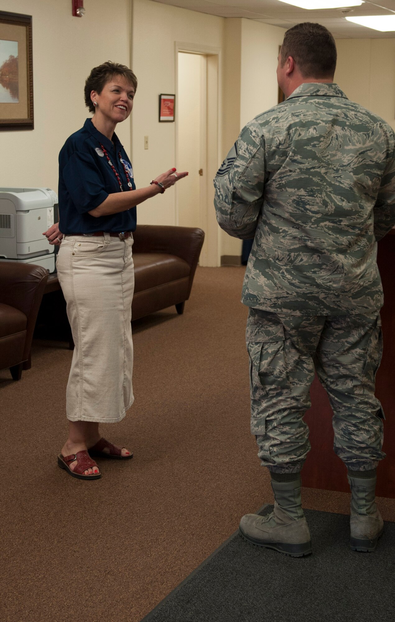 Tressie Taylor, 7th Force Support Squadron Airman and Family Readiness Center community readiness consultant, directs an Airman to the Heroes Hiring Heroes at Dyess Air Force Base, Texas, March 31, 2017. About 100 service members, veterans, retirees and eligible family members attended the event. (U.S. Air Force photo by Airman 1st Class April Lancto)