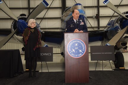 Col. Thomas K. Smith, Jr., 433rd Airlift Wing commander, speaks to a crowd of about 500 guests, after accepting the 433rd AW's induction into the San Antonio Aviation and Aerospace Hall of Fame, March 30, 2017 at the GDC Technics Hanger, Port San Antonio, Texas. (U.S. Air Force photo by Minnie Jones)