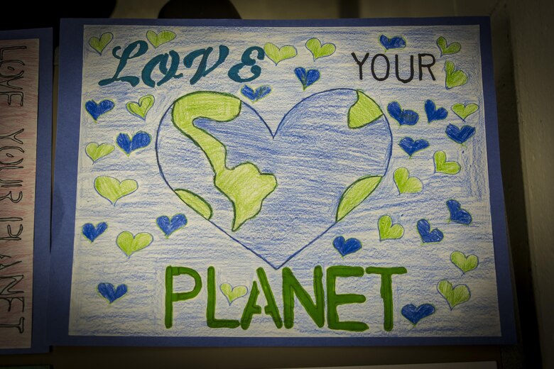 A poster from the Natural Resources and Environmental Affairs Office’s Earth Day poster contest in the Laurel Bay Schools is displayed for judging aboard Marine Corps Air Station Beaufort, April 4. Bolden Elementary and Middle, Elliott Elementary, and Galer Elementary schools participated in the contest. The environmental specialists of NREAO hold the contest annually to promote healthy environmental management habits at an early age.