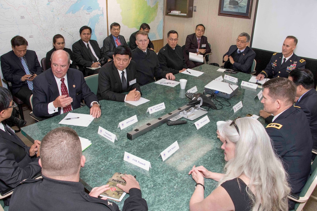 Members of the Mekong River Commission join their counterparts from the Mississippi River Commission in a conference room aboard the Motor Vessel Mississippi for lively discussions and information sharing. 

