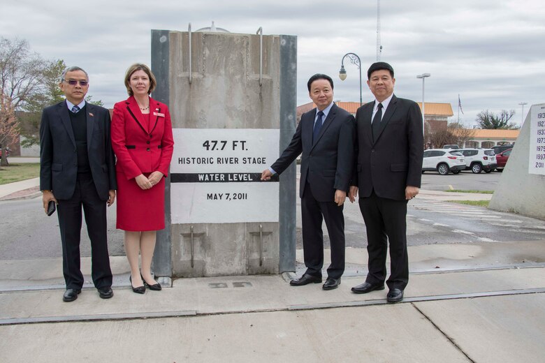 On their way to the first public meeting of the Mississippi River Commission, members of the Mekong River Commission stopped to view flood control works in Caruthersville, Mo. Shown here at a section of the Caruthersville floodwall are (left to right) Mr. Sommad Pholsena, Laotian Minister of Natural Resource and Environment; Elizabeth Burks, Memphis District, Corps of Engineers Assistant Deputy for Project Management; Dr. Tran Hong Ha, Vietnam’s Minister of Natural Resource and Environment; and Lt. Gen. Surasak Karjanat, Chair of Thailand’s Minister of Natural Resource and Environment.