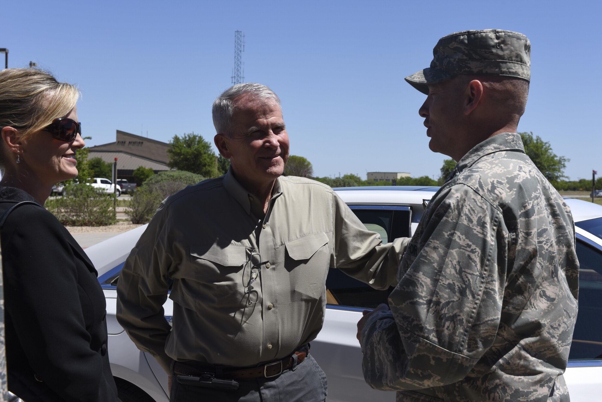 U.S. Marine Corps Lt. Col. (Retired) Oliver North, speaks to U.S. Air Force Col. Michael Downs, 17th Training Wing Commander, at Goodfellow Air Force Base, Texas, April 5, 2017. North visited Goodfellow to see student fire training. (U.S. Air Force photo by Airman 1st Class Chase Sousa/Released) 