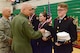 Brig. Gen. Drew Dehaes and Chief MSgt. Timothy Cochran award and congratulate the winners of the knockout competition at the JROTC competition at North High School, Des Moines, Iowa on April 1, 2017. The knockout competition tests the cadet’s ability to respond quickly and precisely to drill commands. (U.S. Air National Guard photo by Airman Katelyn Sprott)