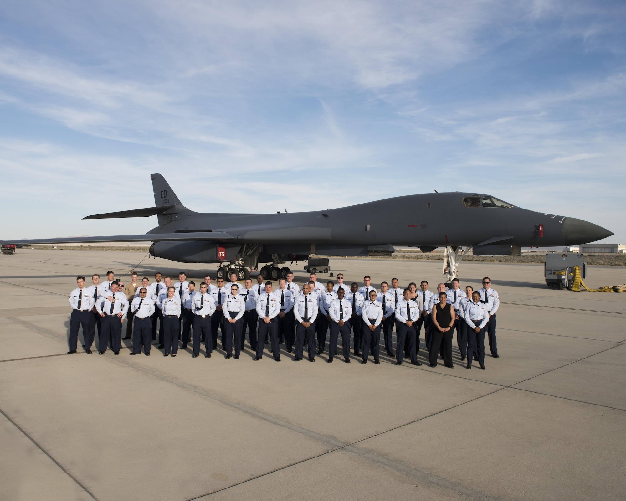 Airman Leadership School Class 17C poses for a group photo in front of a B-1B Lancer March 14. The class is the largest ALS class to ever graduate from Edwards. (U.S. Air Force photo by Joseph Gocong)