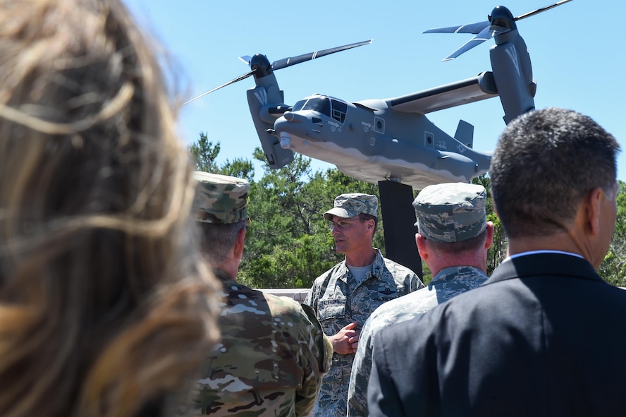 Col. Thomas Palenske, the commander of the 1st Special Operations Wing, speaks during the CV-22 Osprey model dedication ceremony at Hurlburt Field, Fla., April 6, 2017. The CV-22 model, with tail number 0031, was created and installed to memorialize the CV-22 that crashed near Qalat, Afghanistan, April 9, 2010, where two of the crew members lost their lives. (U.S. Air Force photo by Senior Airman Jeff Parkinson)