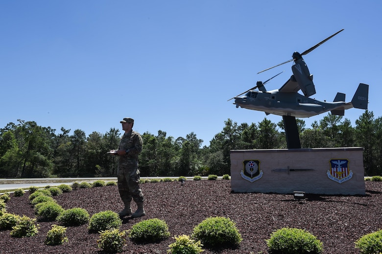 Staff Sgt. Bryan Sibley, a crew chief with the 801st Special Operations Aircraft Maintenance Squadron, welcomes attendees to the CV-22 Osprey model dedication ceremony at Hurlburt Field, Fla., April 6, 2017. The CV-22 model, with tail number 0031, was created and installed to memorialize the CV-22 that crashed near Qalat, Afghanistan, April 9, 2010, where two of the crew members lost their lives. (U.S. Air Force photo by Senior Airman Jeff Parkinson)