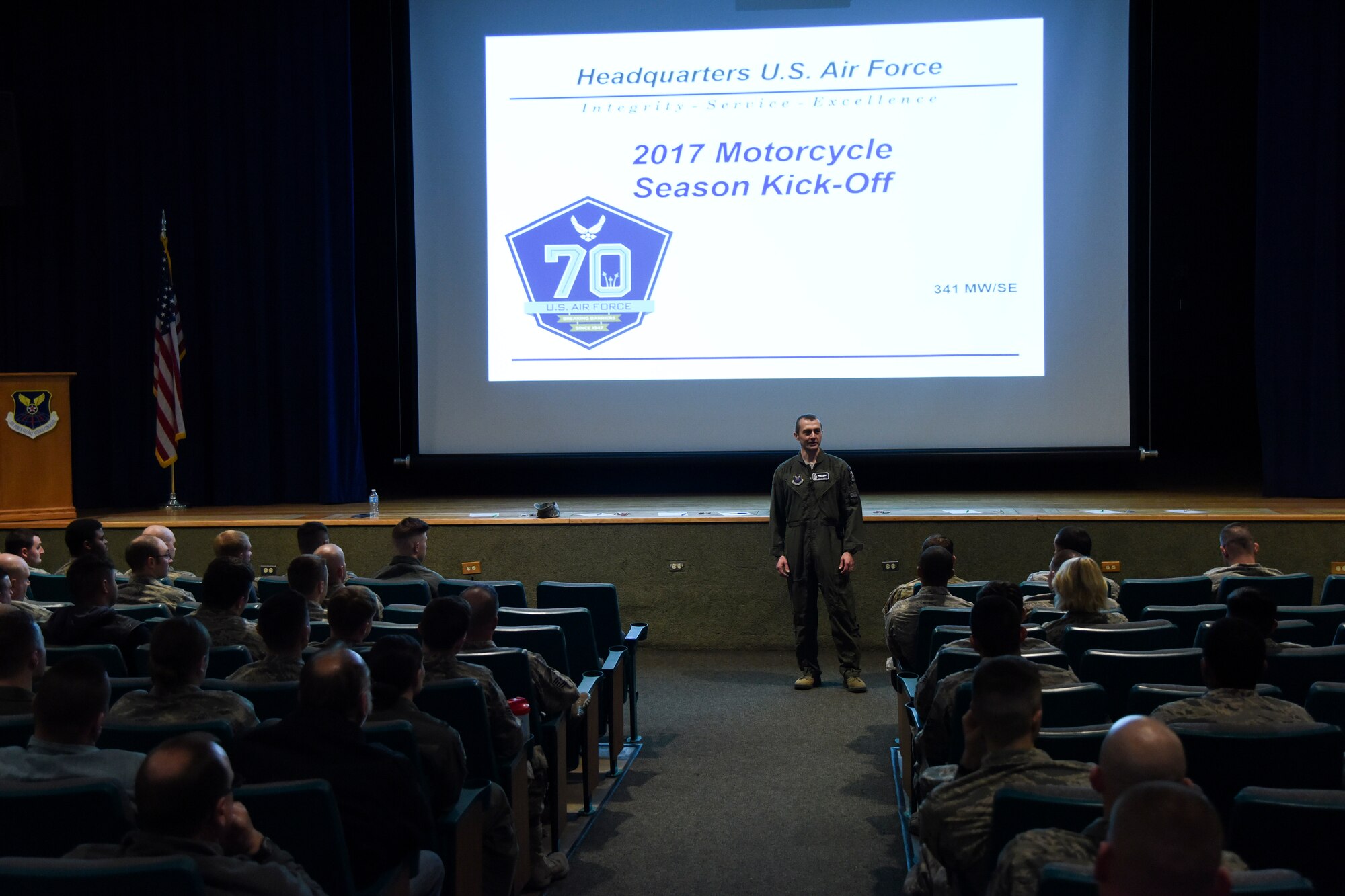 Lt. Col. Kevin Byrd, 341st Missile Wing chief of safety, kicks off the 2017 motorcycle season during a wing brief April 6, 2017, at Malmstrom Air Force Base, Mont. Byrd spoke on the importance of risk management, personal protective equipment and watching out for hazards while riding. (U.S. Air Force photo/Tech. Sgt. Caleb Pierce)