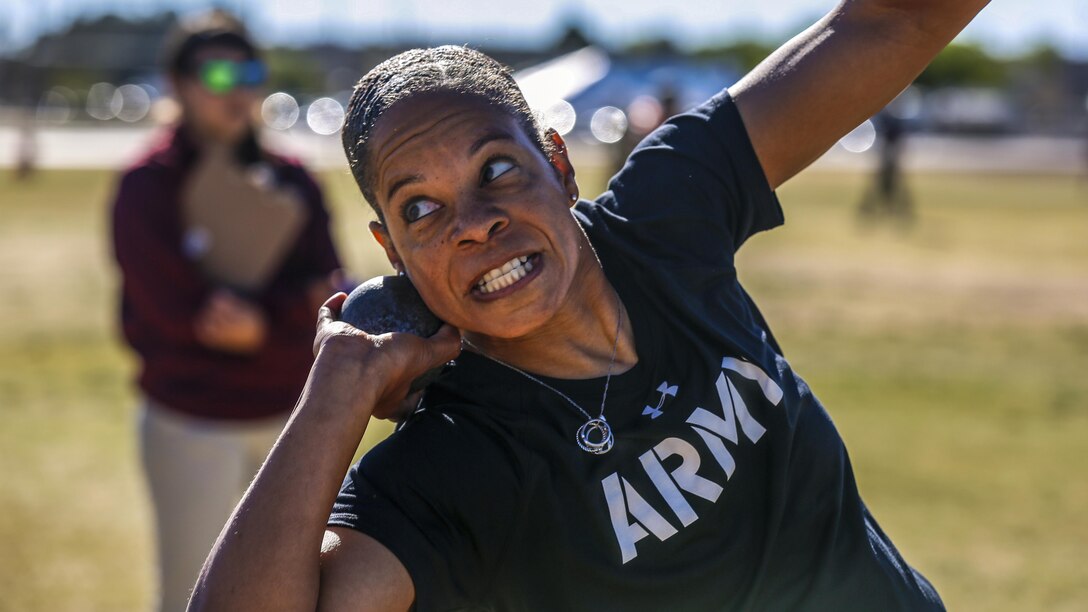 Army Ssg. Altermese Kendrick leans back to throw in the sitting shot put event for the Warrior Care and Transition's Army Trials at Fort Bliss. Texas, April 5, 2017. About 80 wounded, ill and injured active-duty soldiers and veterans are competing in eight different sports to represent Team Army at the 2017 Department of Defense Warrior Games. Army photo by Spc. Fransico Isreal