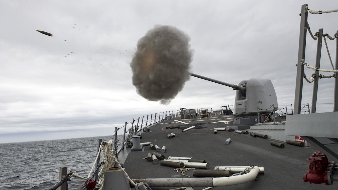 A MK 45 5-inch lightweight gun fires aboard the USS Carney as the ship conducts naval surface fire support qualifications off Cape Wrath, Scotland, April 3, 2017. The Carney is conducting a patrol in the U.S. 6th Fleet area of responsibility to support U.S. national security interests in Europe. Navy photo by Petty Officer 3rd Class Weston Jones
