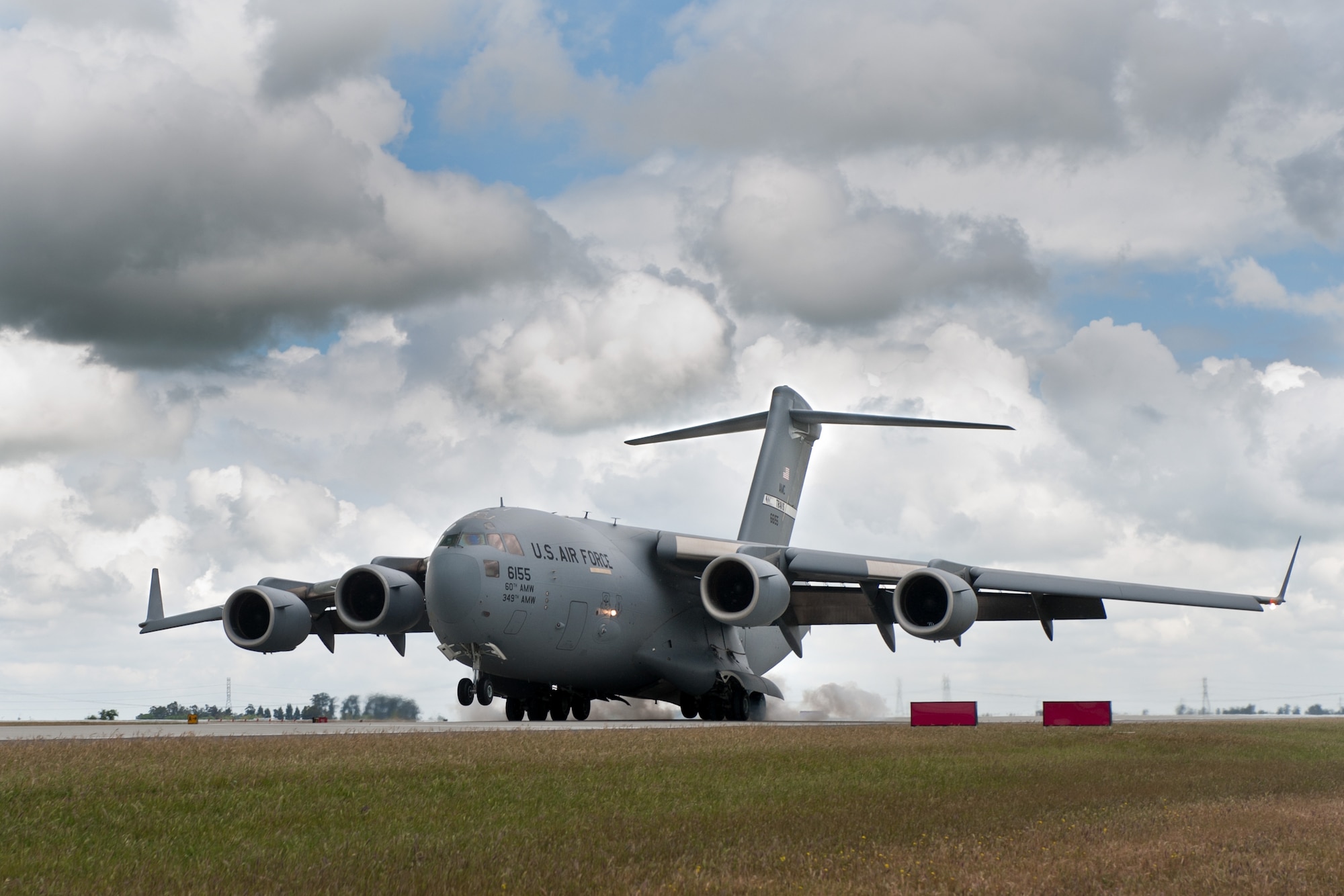 A C-17 Globemaster III from the 21st Airlift Squadron lands at Travis Air Force Base, Calif. The 21st and 22nd Airlift squadrons celebrated their 75th anniversaries April 3. (U.S. Air Force photo/Ken Wright) 