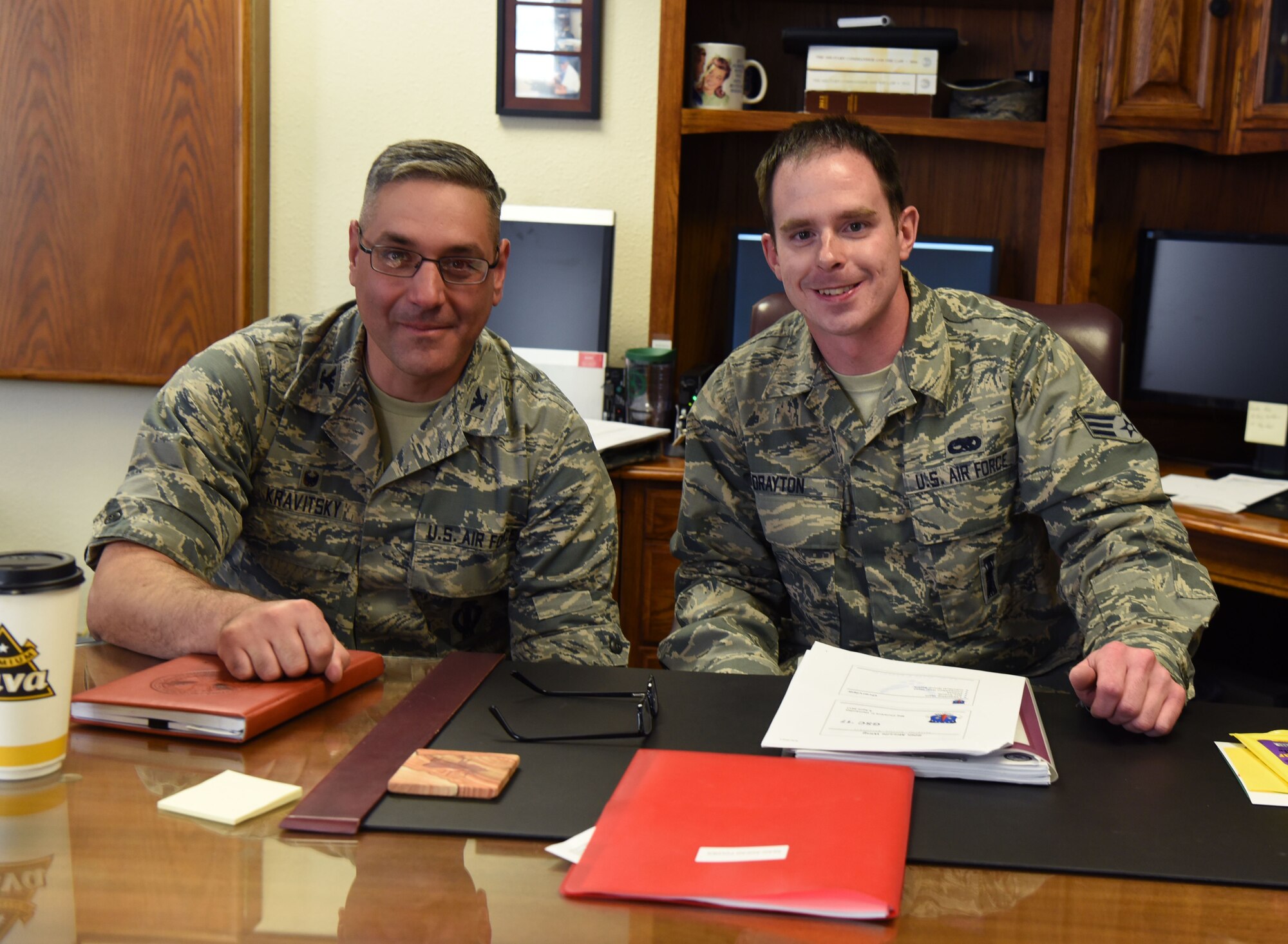 Col. Stephen Kravitsky, 90th Missile Wing commander and Senior Airman Adam Drayton, 90th Missile Maintenance Squadron survivable systems team chief, pose for a photo after spending the day together at F.E. Warren Air Force Base, Wyo., April 5, 2017. The shadow program allows junior Airmen to spend a day with the wing commander and learn how senior leaders lead the wing. (U.S. Air Force photo by Airman 1st Class Breanna Carter)