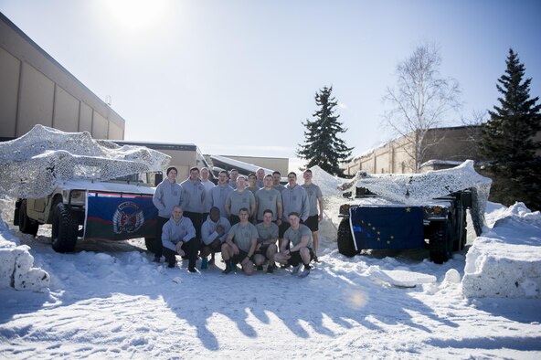 U.S. Air Force Tactical Air Control Party (TACP) Airmen assigned to Detachment 1, 3rd Air Support Operations Squadron, stand outside the Baker Field House March 30, 2017, at Eielson Air Force Base, Alaska. The Airmen were there in support of the TACP memorial run, which honors fallen TACP Airmen. (U.S. Air Force photo by Airman 1st Class Isaac Johnson)
