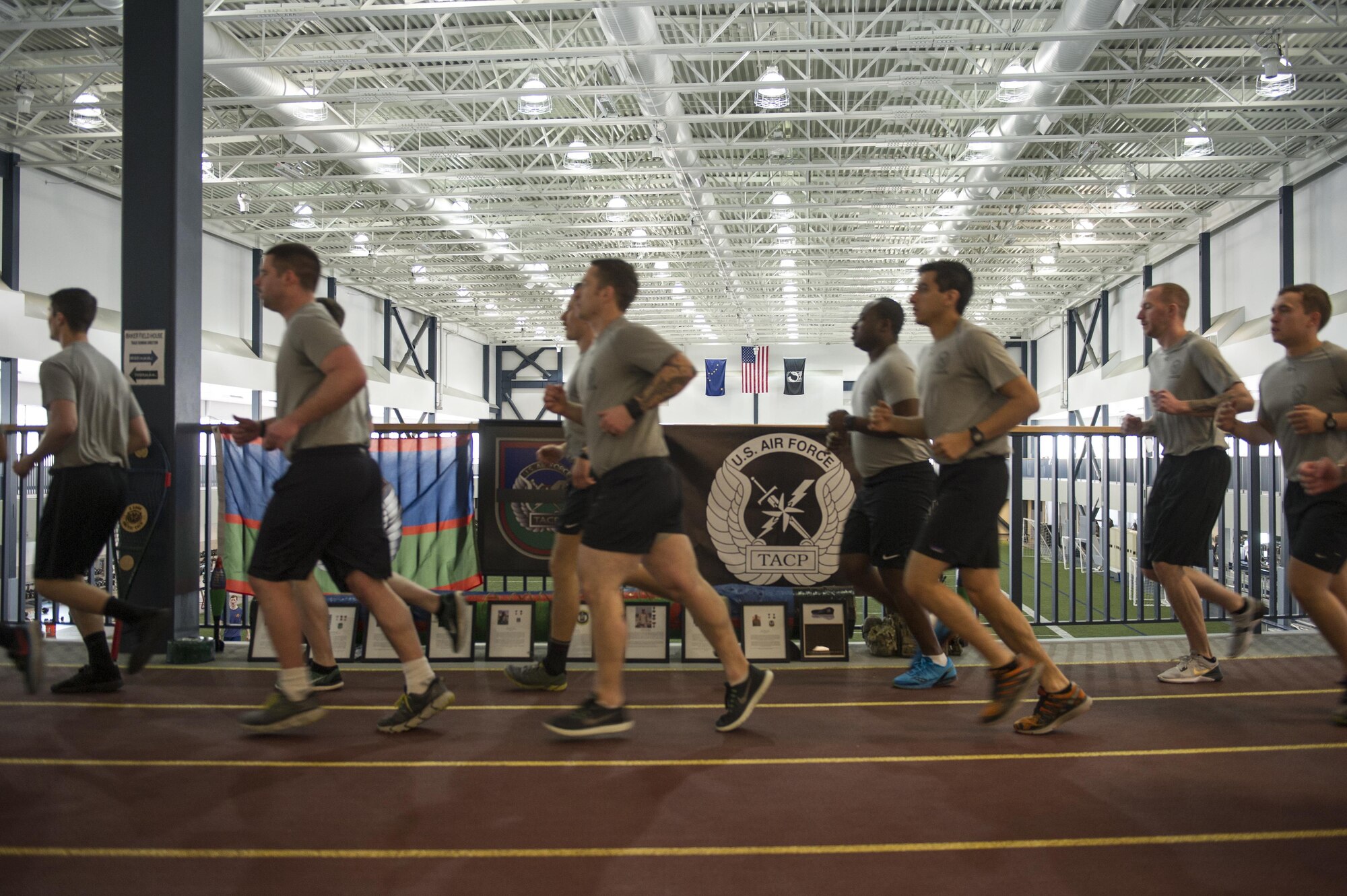 U.S. Air Force Tactical Air Control Party (TACP) Airmen assigned to Detachment 1, 3rd Air Support Operations Squadron, run in formation March 30, 2017, at the Baker Field House on Eielson Air Force Base, Alaska. At the beginning and end of the 24-hour run, all of the TACP Airmen ran together in formation, but during the rest of the run, the Airmen encouraged and received base participation. (U.S. Air Force photo by Airman 1st Class Isaac Johnson)