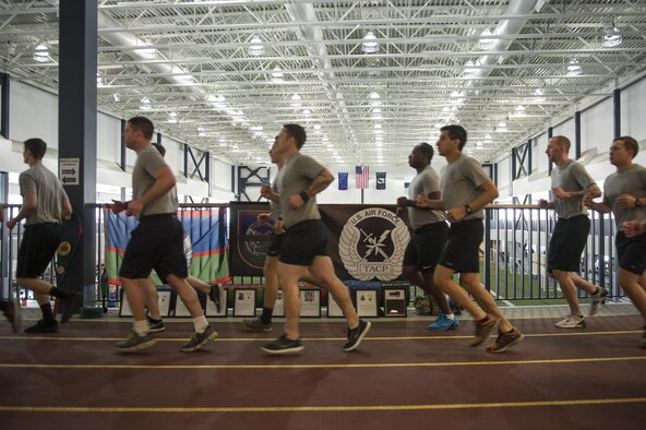 U.S. Air Force Tactical Air Control Party (TACP) Airmen assigned to Detachment 1, 3rd Air Support Operations Squadron, run in formation March 30, 2017, at the Baker Field House on Eielson Air Force Base, Alaska. At the beginning and end of the 24-hour run, all of the TACP Airmen ran together in formation, but during the rest of the run, the Airmen encouraged and received base participation. (U.S. Air Force photo by Airman 1st Class Isaac Johnson)