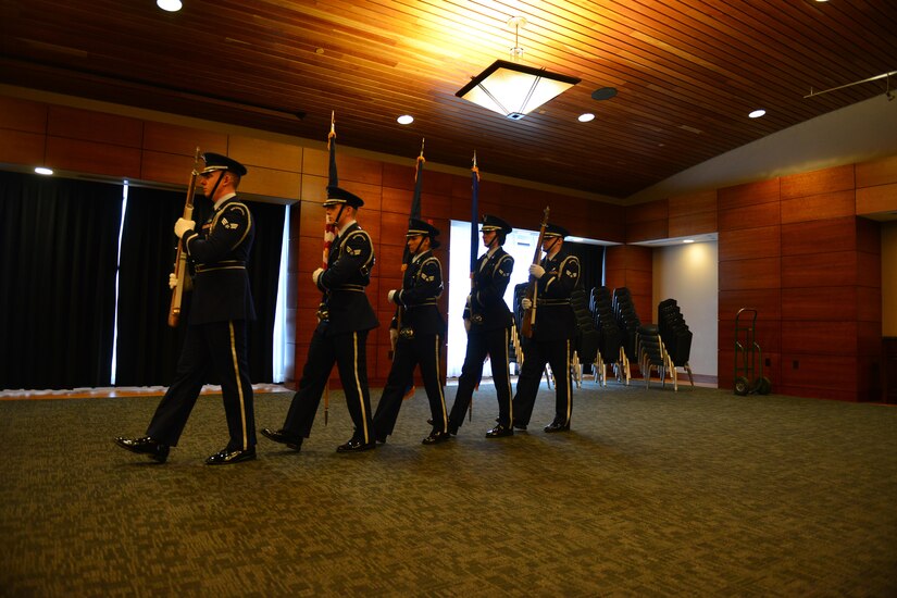 The Joint Base Elmendorf-Richardson Honor Guard begin their presentation of colors during a ceremony where the National Oceanic and Atmospheric Association recognized JBER as their first Species in the Spotlight Recovery Hero. NOAA chose to recognize JBER first because of the effectiveness of their ongoing partnership over the past thirty years.